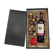 Gift box with red wine and chocolates
