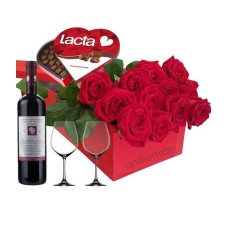 Red roses in a box with chocolates, wine and 2 glasses