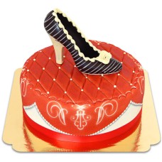 Chocolate shoe on red deluxe cake
