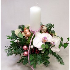 Candle table decoration with white orchids