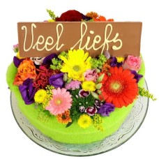 Flower cake with Lots of love bar (Medium multicolored flower cake with a Much Love bar on a glass plate)