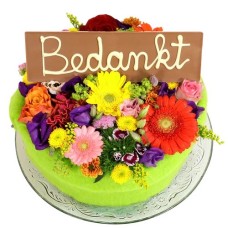 Flower cake with thank you bar (Medium multicolored flower cake with a Thank You bar on a glass plate)