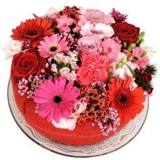 Pink red flower cake (Medium pink and red flower cake on a glass plate)