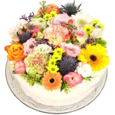 Flower cake Pastel colorful (Medium pastel multicolored flower cake on a glass plate)