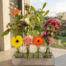 4 flowers put flowers in a holder (Flowers with flowers in a white wash holder)