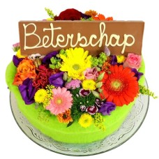Flower cake with get-well bar (Medium multicolored flower cake with a Get Well Soon chocolate bar on a glass plate)
