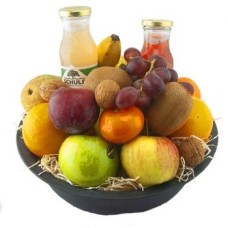 fruit basket with two bottles of juice