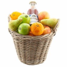 Fruit basket full of picked fruit and juice