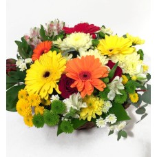 Flower arrangement with a basket of gerberate, ancillary flowers and grapes (Classic)