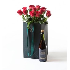 Red roses in a gift bag with bubbles