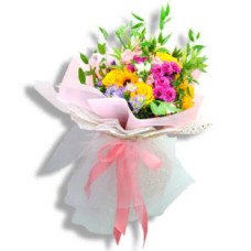 Mixed yellow and pink flowers with greenery