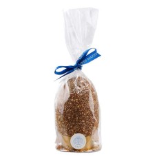 Dark chocolate egg with praline flakes, garnished with eggs, fried goods and praline flakes