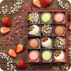 Strawberries in white and milk chocolate with coconut and nut topping and macaroons