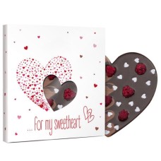 Dark and milk chocolate heart with raspberries