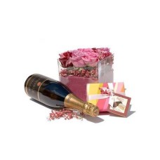 Arrangement of roses, chocolates and sparkling wine