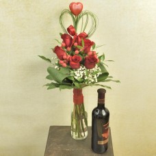 Bouquet of red roses with red wine