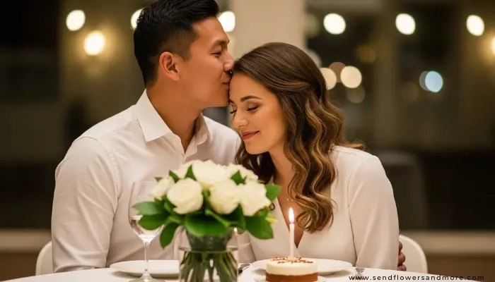 Couple enjoying intimate birthday moment with white roses