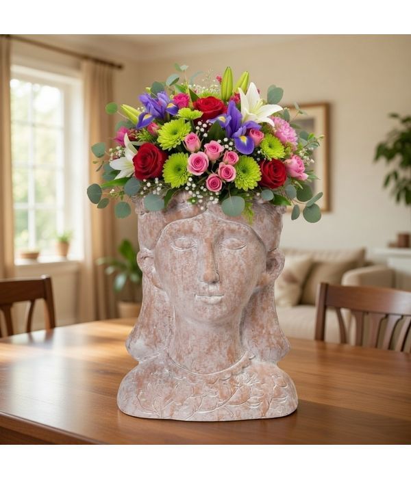 Ceramic head with colorful flower arrangement