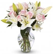 Pink Roses And White Lilies In A Vase