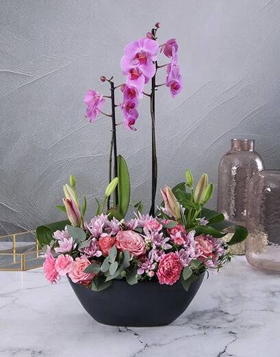 Blushing Pink Flowers in a Boat Vase