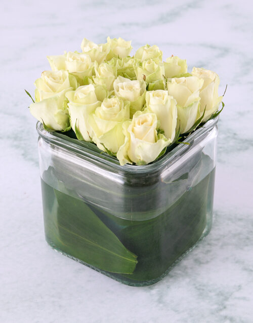 White Roses In Modern Square Vase