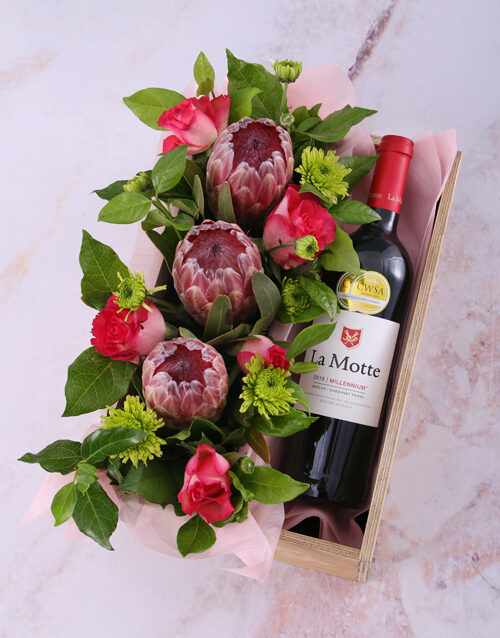 Mixed Proteas And Wine In Crate