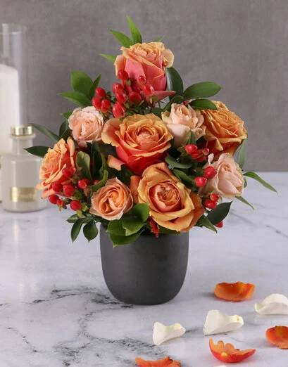 Cherry And Peach Roses In A Black Pot