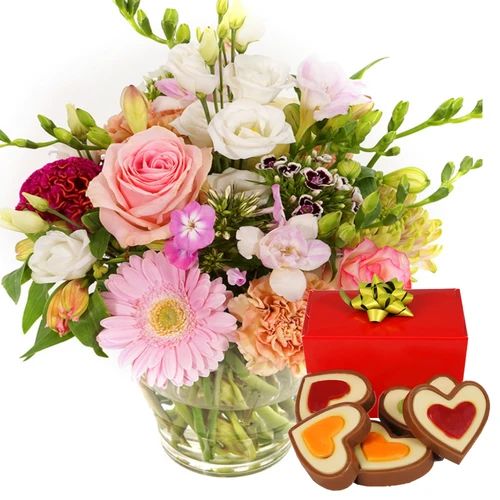 Flowers meets vase + chocolate hearts (Small filled flower vase  with pastel flowers + 140 grams of heart-shaped chocolates)