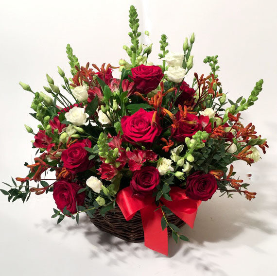 Flaming love: basket arrangement of red roses and other flowers (Deluxe)
