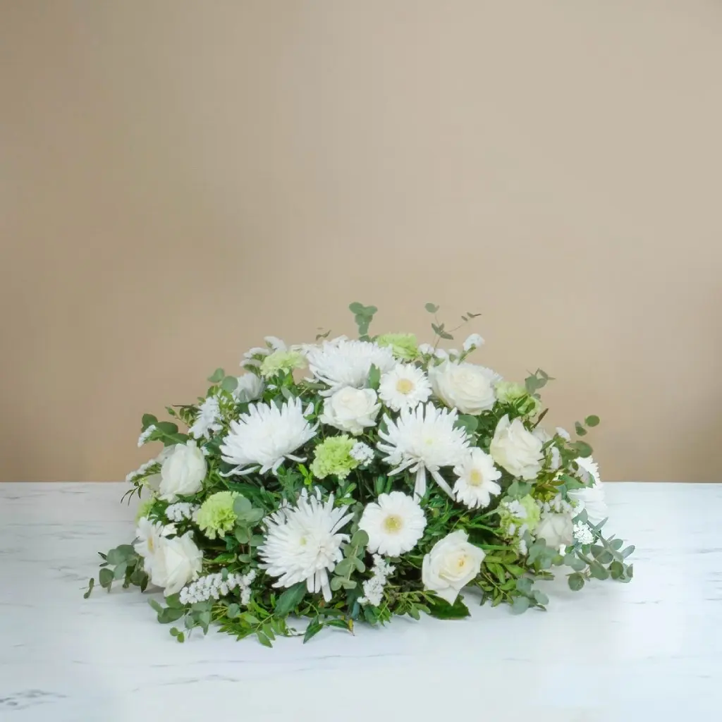 Funeral centrepiece in white tones