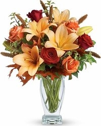 Vase with red lilium, roses, marg. and ocher tones alstromerias