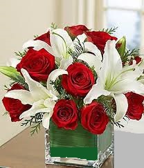 Low arrangement of roses and lilies